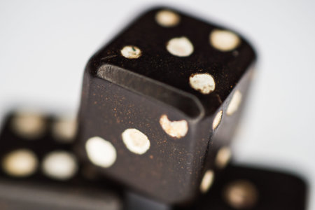 Old dices on a white backgroundの写真素材