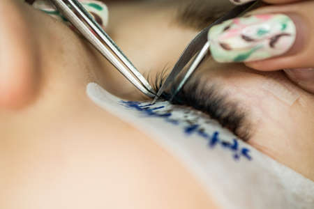 Specialist eyelashes in the beauty salon increases eyelashes clientの写真素材