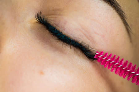 Specialist eyelashes in the beauty salon increases eyelashes clientの写真素材