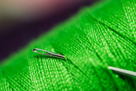 Spool with green cotton threadの写真素材