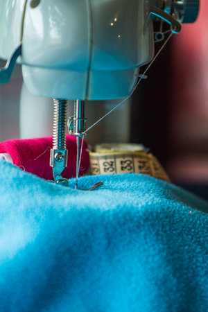 Sewing machine sews fabric