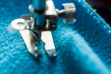 Sewing machine sews fabricの写真素材