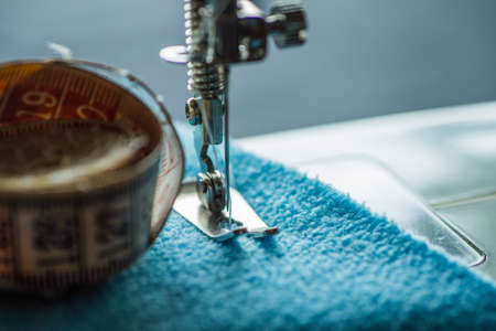 Sewing machine sews fabricの写真素材