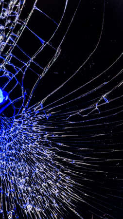 Multi-colored and bright broken smartphone screen close-up.の写真素材