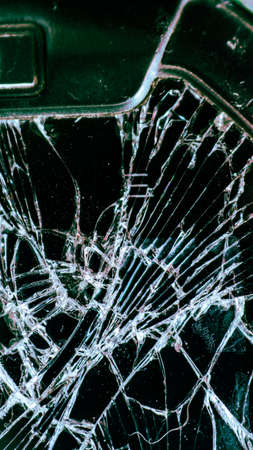 Multi-colored and bright broken smartphone screen close-up.の写真素材