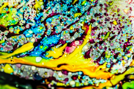 The ink to refill the printer cartridge was spilled onto the white washbasin and the paints blended...