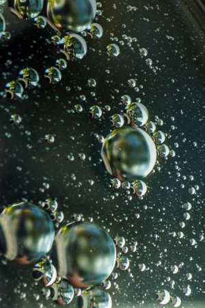 Small bubbles of vegetable oil in water close-up.の写真素材