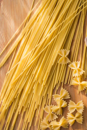 Different types of pasta Cellentani, Tortiglioni, Farfalle, spaghetti are often used in the kitchen for cooking.の写真素材