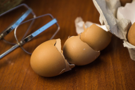 Delicious crispy homemade egg meringue, prepared with love on a wooden background, crunchy dessert for coffee or tea.の写真素材