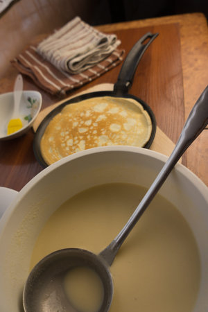 pancake week. Preparation of dough for baking delicious and ruddy pancakes from the ingredients...
