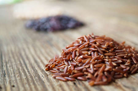 red rice on the rude rustic background ingredientsの写真素材