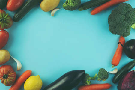 fresh vegetables on blue background with copy space の写真素材