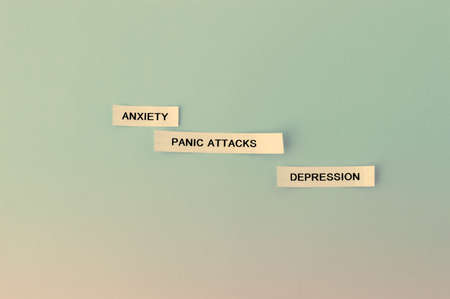 words depression anxiety panic attacks on sticky notes. Health, mental problems. Horizontalの写真素材