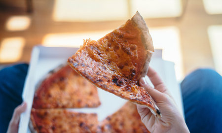 woman eating Italian take away pizza at home 