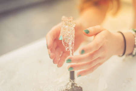 summer hot a woman drinking water outside, hands and water, tourist in Italy の写真素材