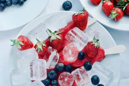 delicious tasty appetizing hand made ice cream with fruits with strawberry blueberry and ice,...