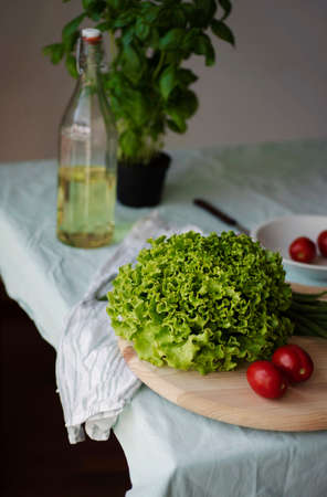 healthy Italian fresh raw vegetables salad tomatoes basil and olive oil on the table. Healthy food concept, detox, vegetarian Italian foodの写真素材
