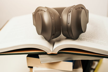 listening to audiobooks, headphones and books, learning studying education conceptの写真素材