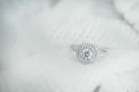 Close up diamond ring on white scarf background with vintage tone.(soft and selective focus)の写真素材