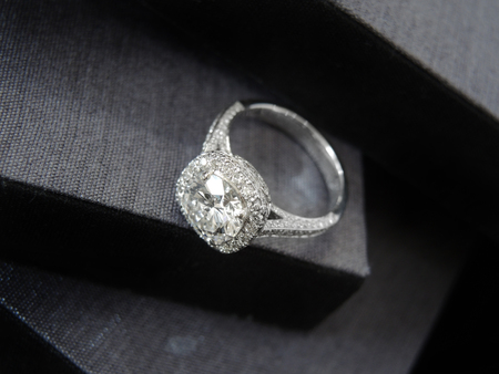 Close up diamond ring with gray and black background (top view)の写真素材