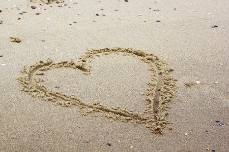 Heart painted in the sand symbol of loveの写真素材