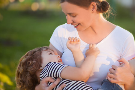 Adorable little daughter with her mother. Loving daughter. Attractive youang mother. Time with...