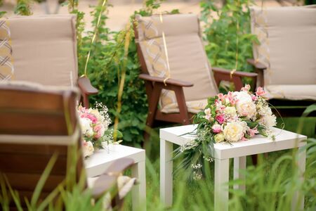 flower arrangement with pink and white roses and peonies, wedding day, outdoorsの写真素材