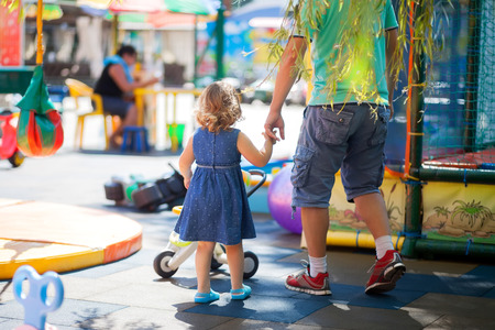 Father play with his toddler daughte. Family leisure. Loving caring single father. Kid playing with parent, kindergarten, playgroundの写真素材