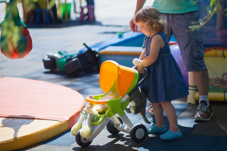 Father play with his toddler daughte. Family leisure. Loving caring single father. Kid playing with parent, kindergarten, playgroundの写真素材