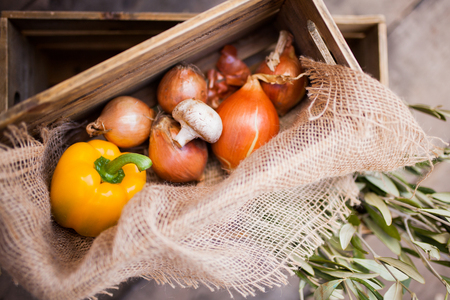 Vegetables prepared for cooking, pepper, pepper, mushroom and onion rustic style, wooden box, farmer marketの写真素材