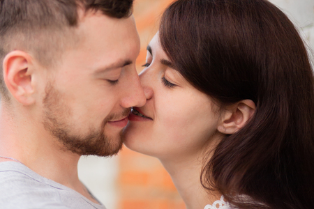 Closeup photo of kissing couple, love, relationsの写真素材