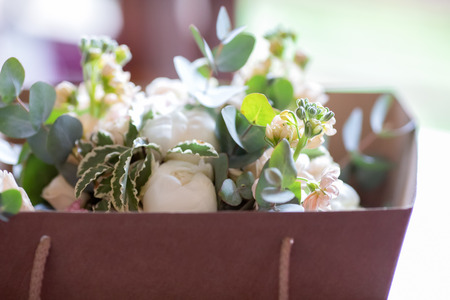 Beautiful wedding bouquet delivered in the paper box, wedding morning, bride's flowersの写真素材