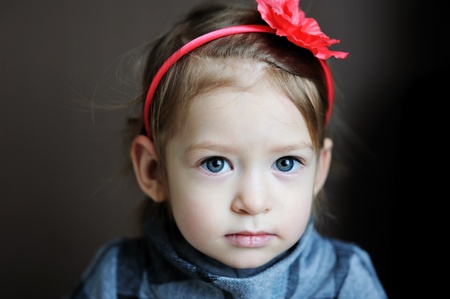 Portrait of adorable baby girl with flower headbandの写真素材