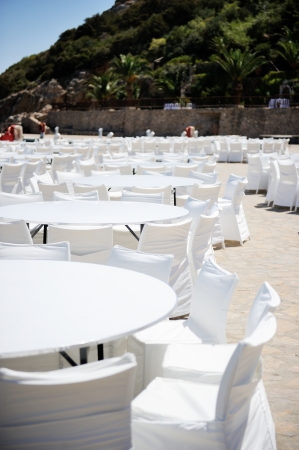 Table set up for a wedding ceremony on beach resortの写真素材