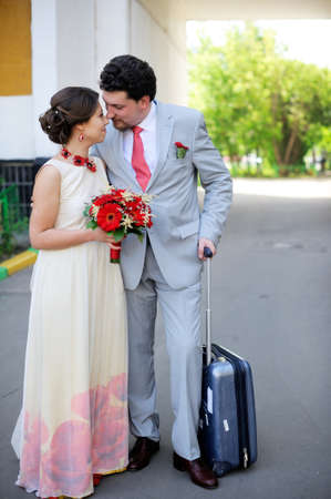 Elegant bride and groom posing together outdoorsの写真素材