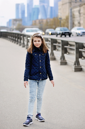 Adorable girl walking and having fun on the spring city streets. Moscow. Russiaの写真素材