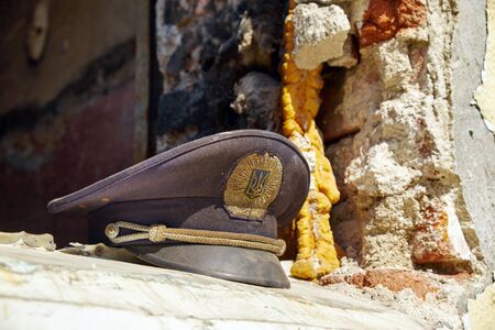 Burned police hat on a destructed window of Mariupol police Departmentのeditorial素材