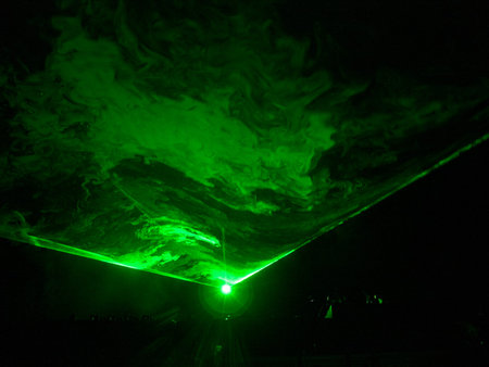 Wide green laser ray with smokeの写真素材