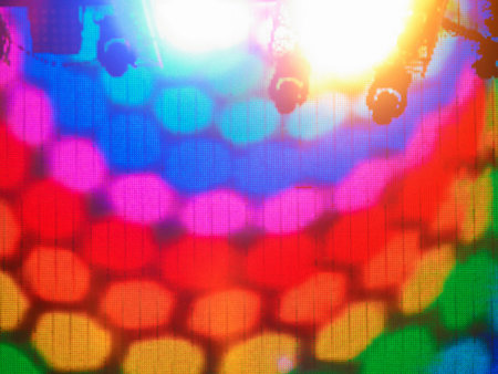 Colorful led screen stage with spotlights on the topの写真素材