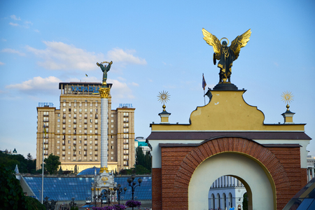 Kyiv, Ukraine - June 06, 2017: Arhistratig Mihail on Lach Gates (Lyadski vorota) from back and Independence monument and Hotel Ukraine on the background at Maidan Nezalezhnosti in Kyiv, Ukraineのeditorial素材