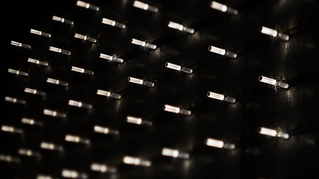 background is out of LED bulbs. white light, monochrome photo