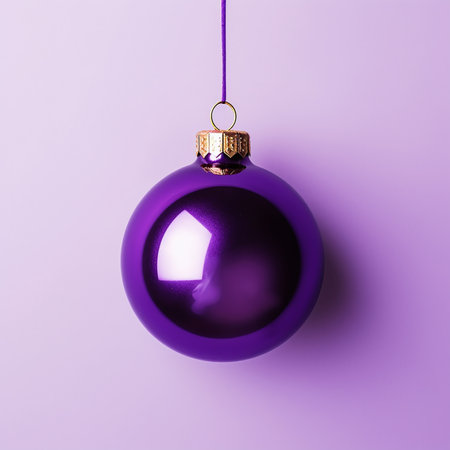 Purple Christmas ball on pastel background. Flat lay, top view with copy spaceの素材