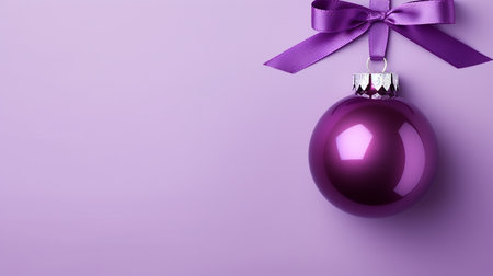 Purple Christmas ball on pastel background. Flat lay, top view with copy spaceの素材