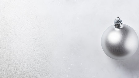 Silver Christmas ball on pastel background. Flat lay, top view with copy spaceの素材