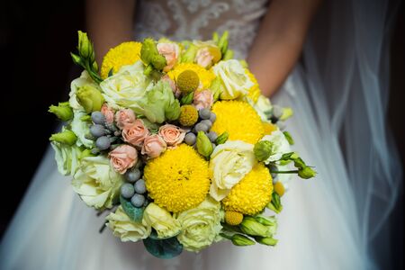 Beautiful bride with wedding bouquetの写真素材