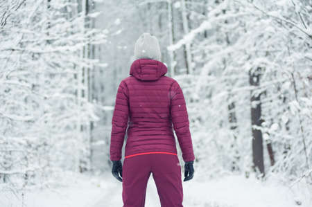 Woman tourist in winter mountainsの写真素材