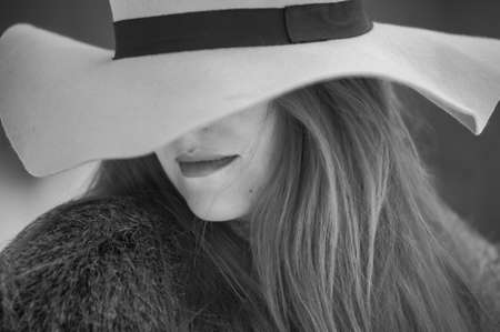 Portrait of red headed pregnant woman in snowy forestの写真素材