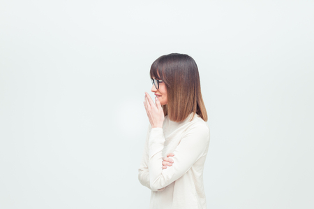 Portrait of a beautiful young woman in eyeglasses on white backgroundの写真素材