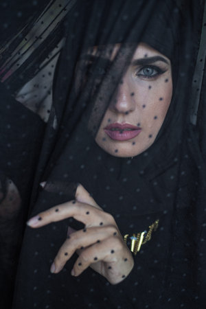 Young asian muslim woman in head scarf smile. Beautiful middle eastern woman wearing abaya. Arabian woman. Strict formal outfit and elegant appearance. islamic fashion.の写真素材