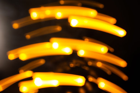 abstract background with bokeh defocused lights on black background